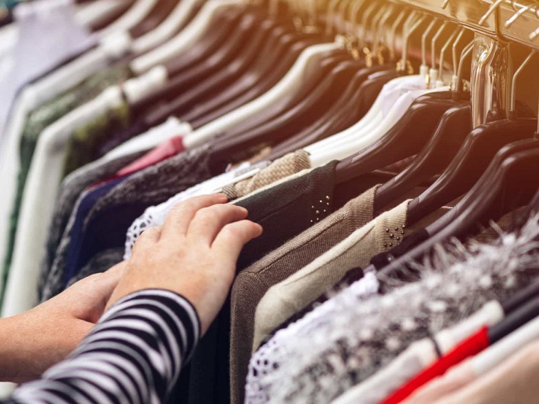 Looking through a womens clothes rack