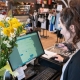 Woman working the register at The Closet Trading Company