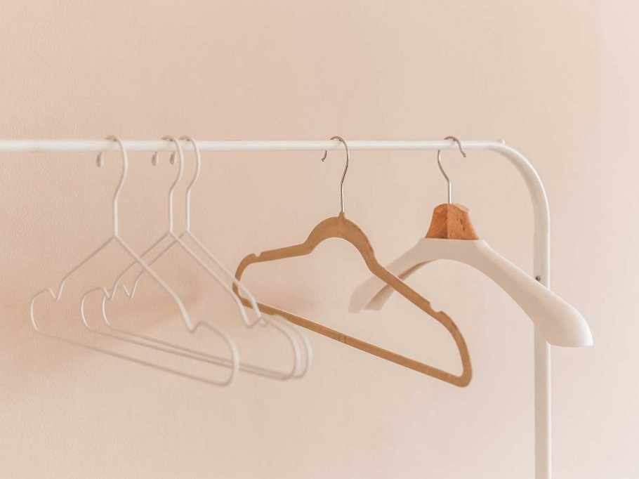 empty closet with nothing but clothes hangers