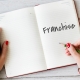 Notebook writing the reasons to franchise a business